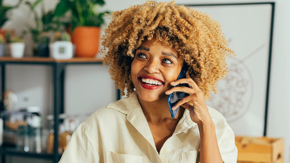 woman talking on the phone smiling