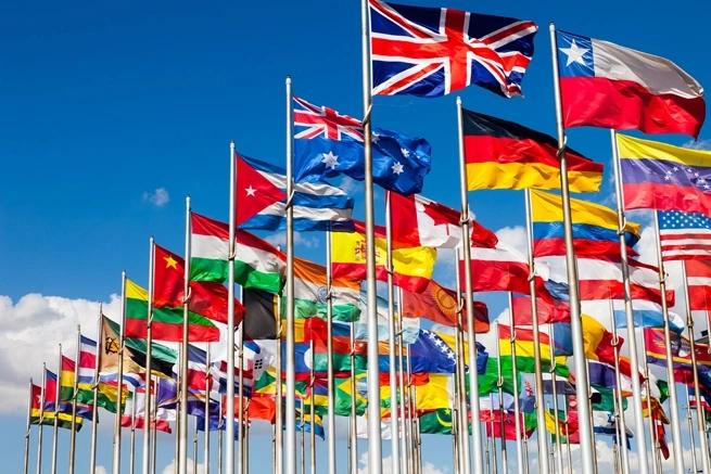 flags from may countries waving in the wind