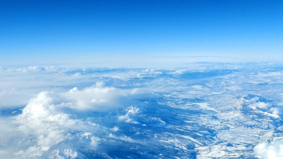 snow field aerial view in clouds